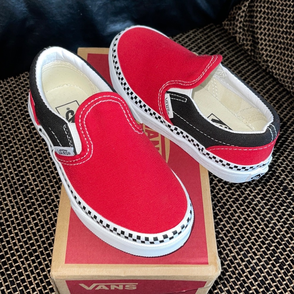 Red, black, white, and checkerboard slip-on vans.